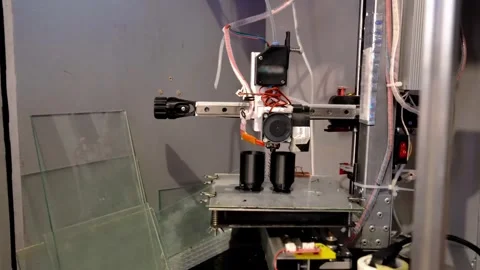 A 3D printer prints plastic parts using fused filament manufacturing technology Stock Footage 329242563