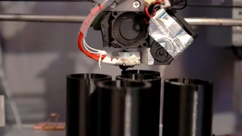 A 3D printer prints plastic parts using fused filament manufacturing technology Stock Footage 329242566