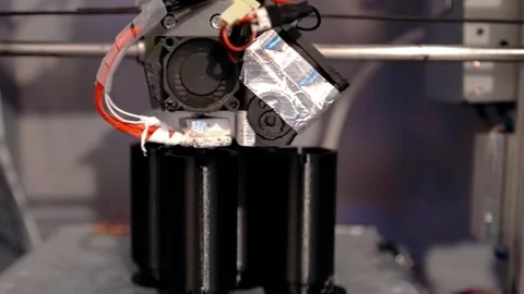 A 3D printer prints plastic parts using fused filament manufacturing technology Stock Footage 329242569