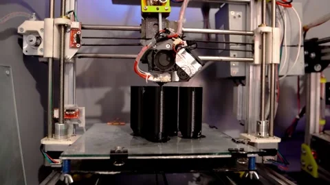 A 3D printer prints plastic parts using fused filament manufacturing technology Stock Footage 329242626
