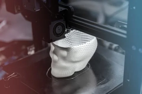 The 3D printer prints white plastic model Stock Photos