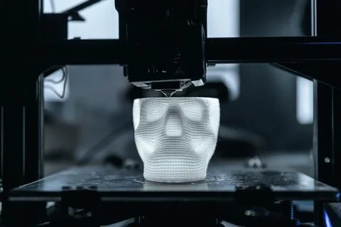 The 3D printer prints white plastic model Stock Photos