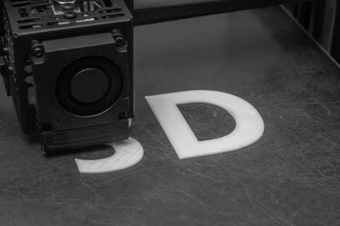 3D printer prints the word 3D with white filament PLA Stock-Fotos