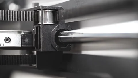 3D printer timing belt moving inner carriage along a polished metal rod Stock Footage 335213569