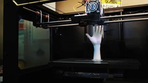 3D printer at work, 3D printer print the human hand, 3D printer print the whiter Stock Footage 79740071