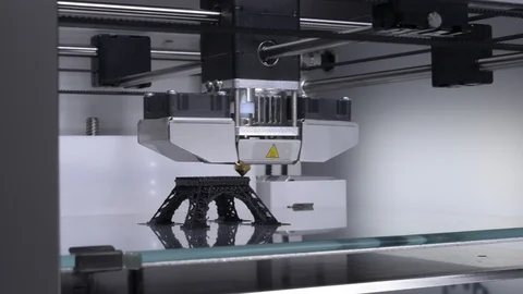 3D printer at work, printing the Eiffel Tower with black filament Stock Footage 90421050