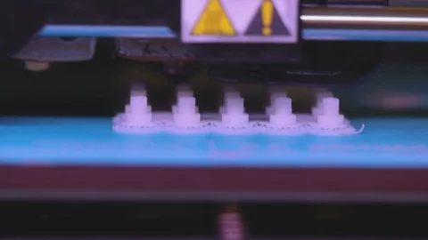 3D printer working. 3D printer printing an object from plastic. Automatic three Stock Footage 111727595
