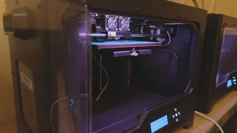 3D printer working. 3D printer printing an object from plastic. Automatic three Stock Footage 111826546