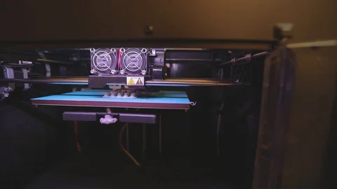 3D printer working. 3D printer printing an object from plastic. Automatic three Stock Footage 112192816