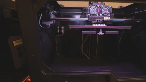 3D printer working. 3D printer printing an object from plastic. Automatic three Stock Footage 112598983