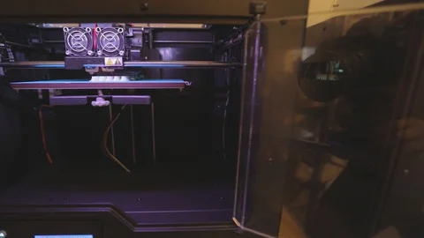 3D printer working. 3D printer printing an object from plastic. Automatic three Stock Footage 119399968