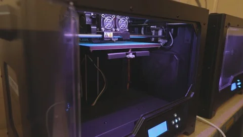 3D printer working. 3D printer printing an object from plastic. Automatic three Stock Footage 119988626