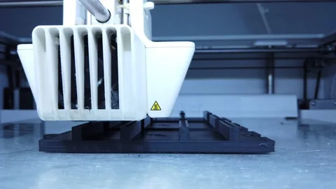 3D printer working. 3D printer, printing with plastic wire filamen Stock Footage 140874064