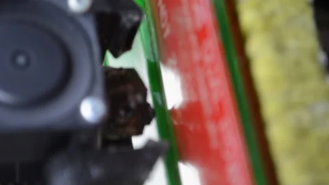 3D printer. Working 3d printer. 3d printer printing molten plastic. Vertical Stock Footage 238430062