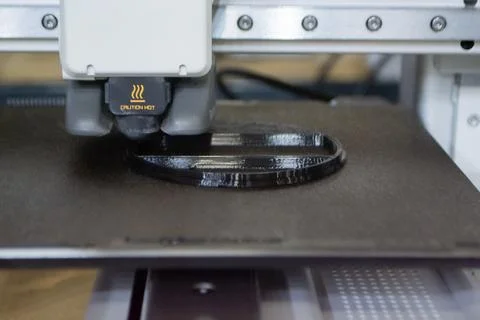 3D printer Working 3D printer process printing object molten black plastic Stock Photos