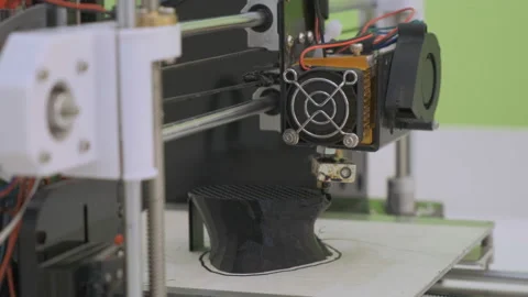 3D printer working close up. Automatic three dimensional 3d printer performs Stock Footage 107256777