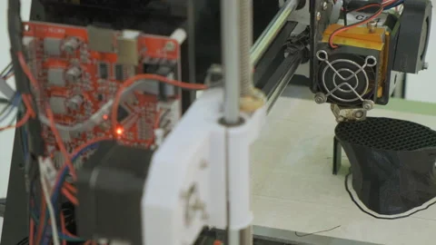3D printer working close up. Automatic three dimensional 3d printer performs Stock Footage 107257269