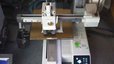 3D printer working on a high-precision model with plastic material for printing Stock Footage 328258631