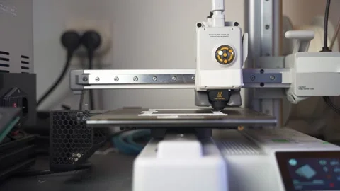 3D printer working on a high-precision model with plastic material for printing Stock Footage 328258650
