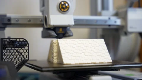3D printer working on a high-precision model with plastic material for printing Stock Footage 328258700