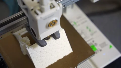 3D printer working on a high-precision model with plastic material for printing Stock Footage 328258729