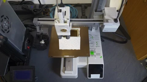 3D printer working on a high-precision model with plastic material for printing Stock Footage 328258744