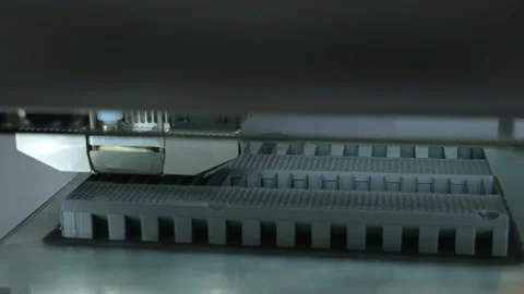 3D printer working. Print head of 3D printer machine printing plastic workpiece. Stock Footage 147106199