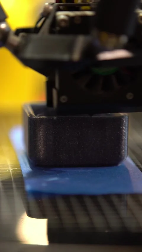 3D printer working, printing square piece filament in Science Laboratory Stock Footage 317260873