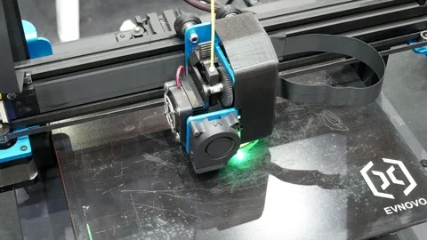 3D printers are printing digital images from computers in 3D form. Image Video stock 122973052