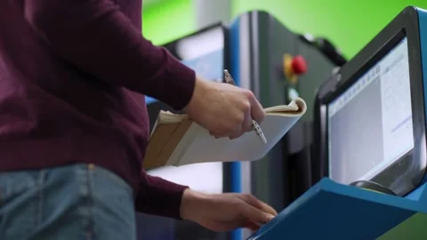 3d printing engineer making notes in notepad Stock Footage 142163792