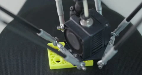 3D Printing Machine printing a piece of plastic Video stock 143170797