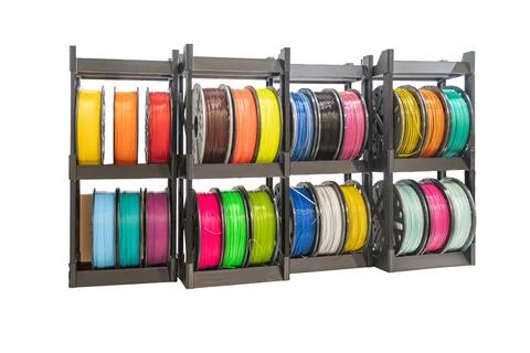 3D printing materials display featuring colorful filaments neatly arranged .. Stock Photos