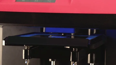 3D printing mechanism close up 4k video. Additive manufacturing machine Stock Footage 70672619