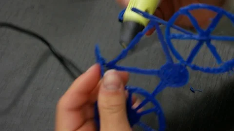 3D printing pen working by melting plastic to create a model Stock Footage 90032849