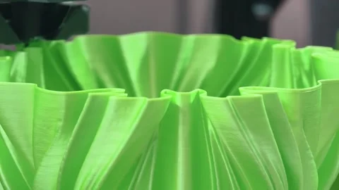 3D printing process of creating intricate green plastic parts in a modern Stock Footage 315421629