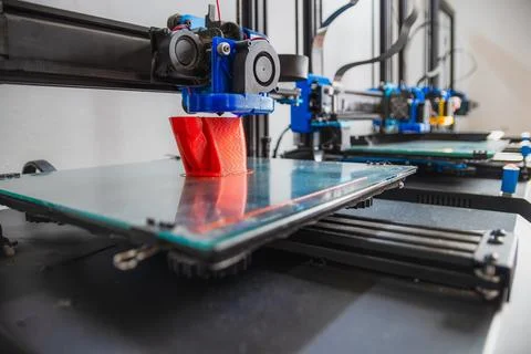 3D printing in progress. High quality photo of printers working in a row. Stock Photos