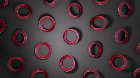 3D red glass torus rotating on dark surface. Abstract creative 4k seamless loop  Stock Footage 104750954