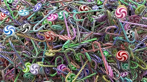 3d render abstract background with christmas candies. A lot of candies are ly Stock Illustration