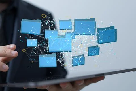 3D render of blue folder icons floating above a tablet with a man holding his Foto stock