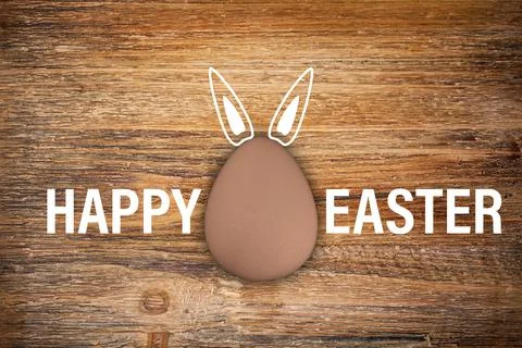 3d render of brown egg and the text Happy Easter on rustic wood イラスト素材