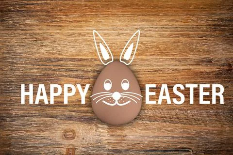 3d render of brown egg with Easter bunny face and the text Happy Easter Illustrazione stock