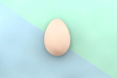 3d render of a chicken egg on a blue-green background. View from above. Stock Photos