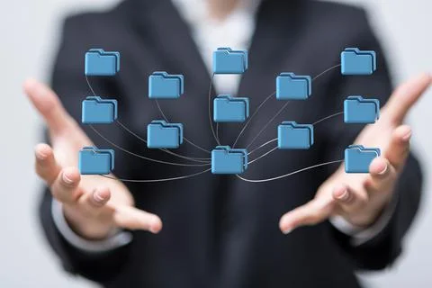 3D render of cloud storage in folder icons being manipulated by a person in a ho Foto stock