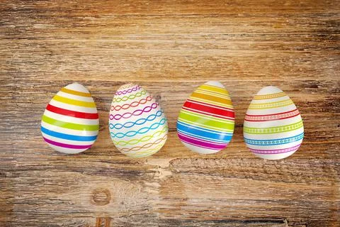 3d render - four colorful easter egg on dark wood table Stock Illustration