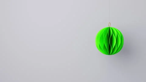 3D render of a green Christmas paper ball on light background Stock Footage 293058199