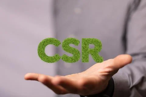 3D render of green CSR letters in hand for the Corporate social responsibility Foto stock
