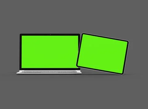 3d render of laptop and tablet with green screen on a dark background Stock Illustration