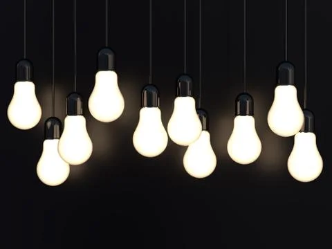 3d render of light incandescent bulbs glowing on black Illustrazione stock