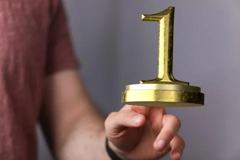 3D render of the number 1 on a trophy being manipulated by a person in a hologra 스톡 사진