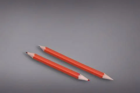 3d render of a pair of two-sided orange pencils on a gray background Stock Illustration